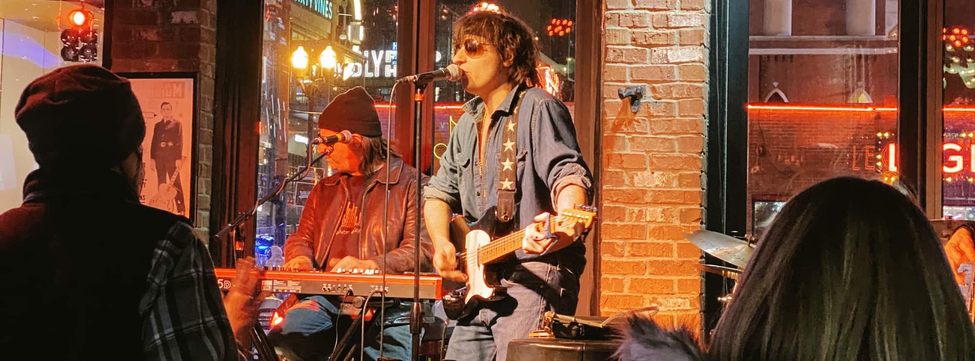 bar singer on guitar in Columbia